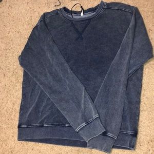 Loose fitting distressed long sleeve shirt
